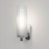 The Ottavino wall light features a modern cylindrical design with ribbed glass and a polished chrome lampholder. Shows a 3/4 view of the unit. IP44 rated and safe for use in bathrooms.