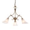 The Hardwick pendant light features elegantly curved arms in antique brass with frosted glass shades encasing 3 lamps.