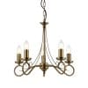 The Trafford pendant light is a classic chandelier with 5 elegantly curved, sweeping arms in an antique brass finish.