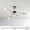 Shows the Mercury ceiling light in a room. The light features 3 curved arms complete with double layered glass shades. Each shade features a frosted inner shade and a clear, decorative outer shade with water drop decoration. Available in a satin chrome finish.