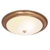The Atlas ceiling light features a traditional design with a large acid etched glass shade and decorative antique brass metalwork detailing. Shows the fitting when it's switched on.