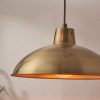 Shows a close up of the Polka pendant light lamp shade. The pendant features a traditional design with a rise and fall suspension system in a brass plate finish. Height adjustable from a range of 92cm to 198cm.