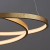 Shows a close up of the Scribble pendant light's looping design and gold leaf finish.