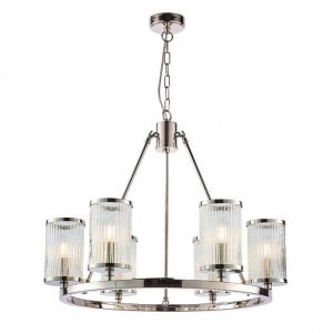 The Easton pendant light fuses the modern with the classic with this bright nickel-plated chandelier. Inspired by hurricane lamps, the clear, ribbed glass shades with bubble details create a perfect diffused light when lit by filament LED lamps. Each shade rests atop a hoop and is supported by three fixed arms.