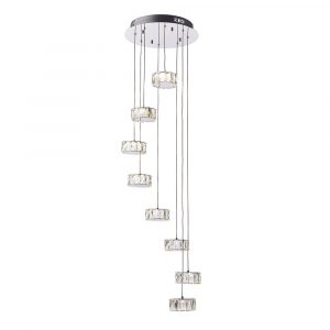 The Prisma pendant light features eight lamps suspended in descending heights from a polished chrome base. Each lamp is enclosed in a small, faceted crystal shade.