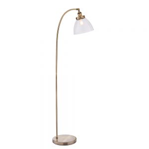 The Hansen floor light is an industrial style light in antique brass with ridged lampholder and clear glass shade.