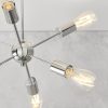 Close up of the Rubens ceiling light, which has a descended central globe with multiple arms extending outward ending in a LED filament bulb. The fitting has a chrome plated finish.