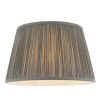 The Freya lampshade features gathered pleated silk in charcoal with a matching taped edge, pale ivory inner lining, and a reversible gimbal allowing the shade to be used as a table or pendant light.