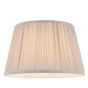The Freya lampshade features gathered pleated silk in dusty pink with a matching taped edge, pale ivory inner lining, and a reversible gimbal allowing the shade to be used as a table or pendant light.