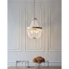 Shows the Celine pendant light hanging over a dining table in a white room. The pendant features a tiered drop chandelier with rose gold effect metalwork and clear glass bead detailing with five central lamps.