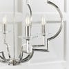 Shows a close up of the Garland pendant light's decorative arms finished in polished nickel and the crystal glass lamp holders.