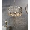 Shows the Eldora pendant light which features an ornate design, with hundreds of suspended hexagonal plates in a chrome plate finish.