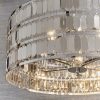 Close up of the Eldora pendant light's base which features an ornate design, with hundreds of suspended hexagonal plates in a chrome plate finish.