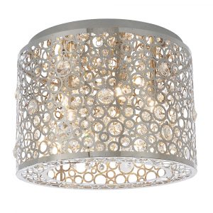 The Fayola ceiling light features a modern and striking design. The shade has an intricate laser cut pattern with a chrome finish and premium crystal bejewelled detailing enclosing five lamps.
