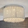 Shows a close up of the Galina ceiling light in an elegant room. Features a shade of delicate twisted chrome rods enclosing high quality K9 clear hanging crystals.
