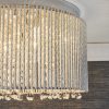 Shows a close up of the Galina ceiling light's side. Features a shade of delicate twisted chrome rods enclosing high quality K9 clear hanging crystals.