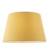 The Evie lampshade features a contemporary, tapered design. ø14 inches with gold cotton fabric, rolled edges, and reversible gimbal so that the shade can be used for a table lamp or pendant.