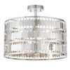 The Eldora ceiling light features an ornate design, with hundreds of suspended hexagonal plates in silver plate finish, enclosing 3 lamps.