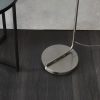 Close up of the Toledo floor light circular base made of sleek metal in a brushed nickel finish. Complete with inline foot switch.
