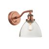 The Hansen wall light is an industrial style light in aged copper with ridged lampholder and clear glass shade.