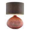 The Liva table light with copper plated base and raised surface detailing. Round spherical base. Cylindrical grey silk shade.
