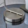 Shows a close up of the circular base, measuring 20cm in diameter, of the Toledo table light, featuring a brushed nickel finish.