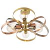 The Hoop ceiling light features six lights with interwoven hoops in a mix of brushed nickel, brass, and copper finishes. The LED bulbs are set centrally in each hoop.