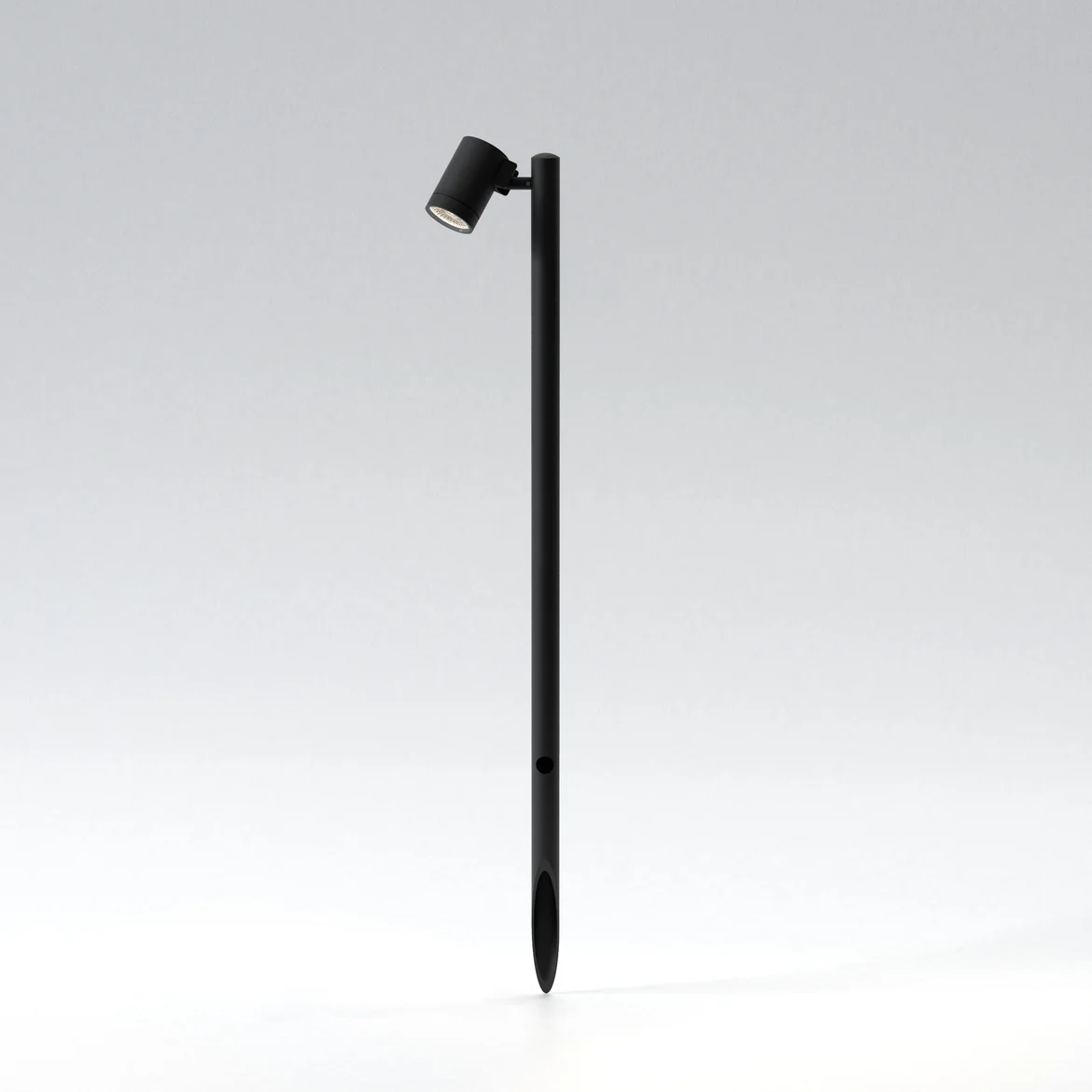 The Bayville Spike 900 spot light features a sleek, modern design with cylindrical body ending in a spike for outdoor in-ground installation with a mounted spotlight. Made from steel and available in a textured black finish. IP66 rated and suitable for outdoor use. Comes complete with an integrated 8.1W LED in 3000K.