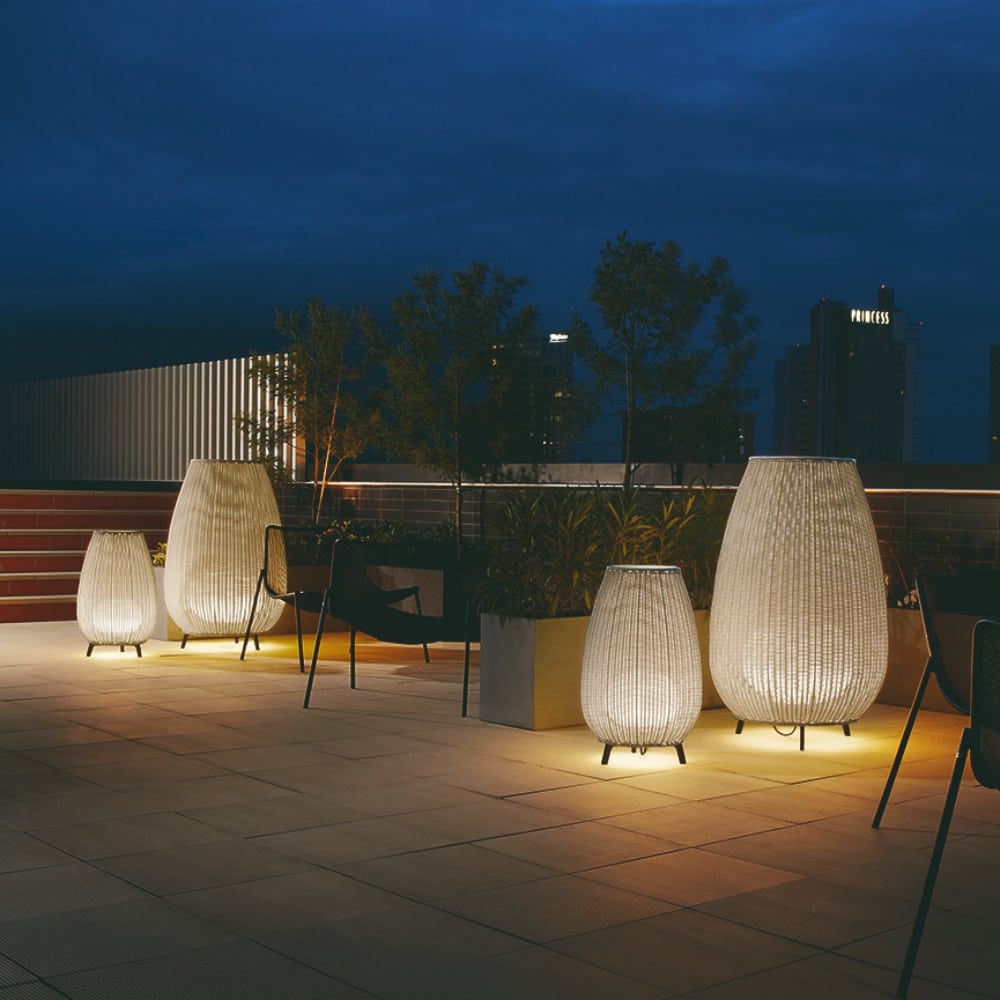 Bover Lighting - A multiple range of sizes of Amphora lamps outside on a patioed garden